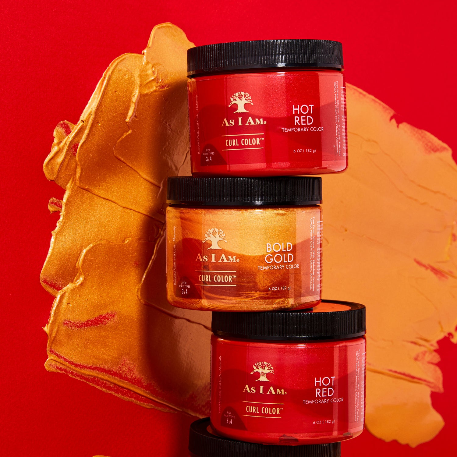 As I Am Curl Color in Hot Red en Bold Gold - twee gestapelde potjes met levendige tijdelijke haarkleurgels die krullen een rijke kleur, definitie en glans geven.