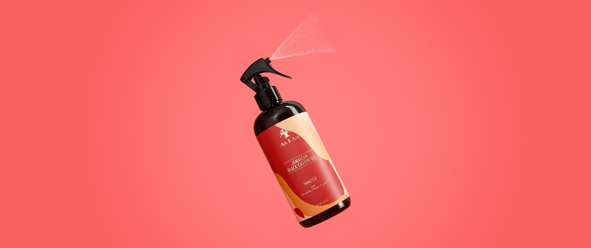 As I Am Jamaican Black Castor Oil Water - landschapsopname van de lichtgewicht leave-in spray met JBCO, geformuleerd om natuurlijke krullen te hydrateren, ontwarren en revitaliseren.