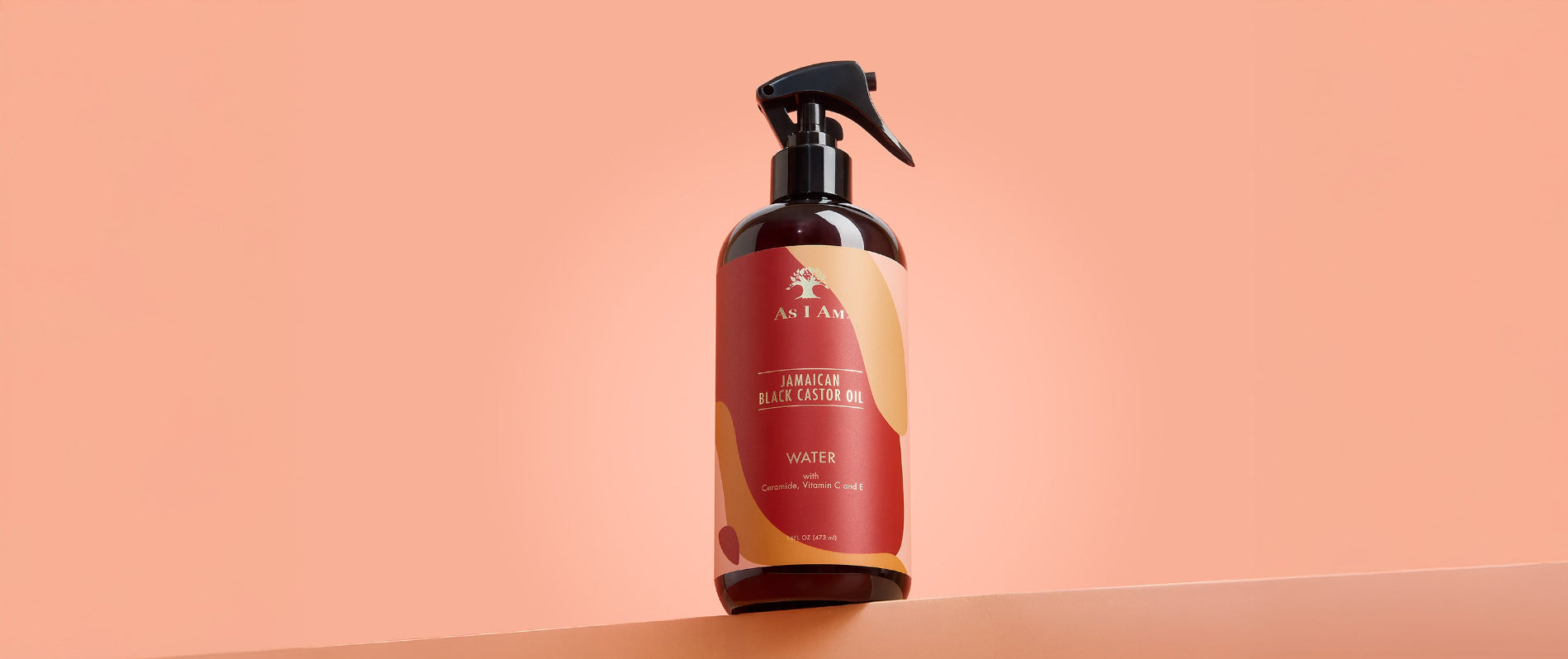 As I Am Jamaican Black Castor Oil Water - landschapsafbeelding van de hydraterende leave-in spray ontworpen om krullen te verfrissen, droog haar te hydrateren en gezonde groei te ondersteunen met JBCO.
