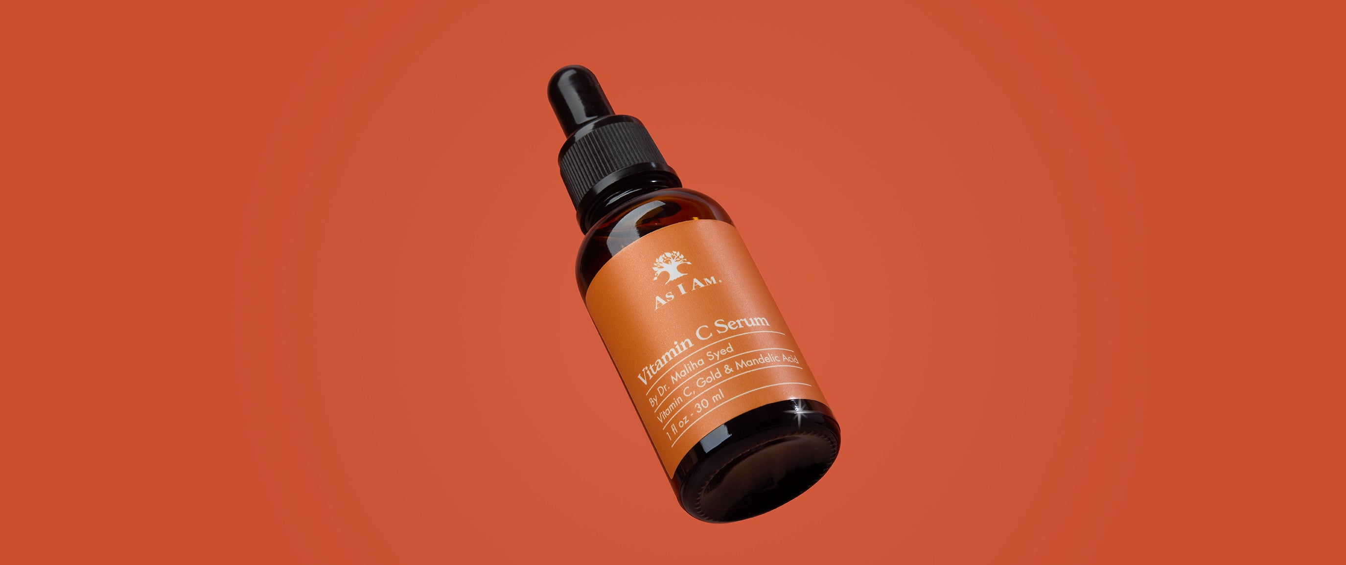 Flesje met druppelaar op een oranje achtergrond